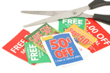 Photo showing clipped coupons and scissors